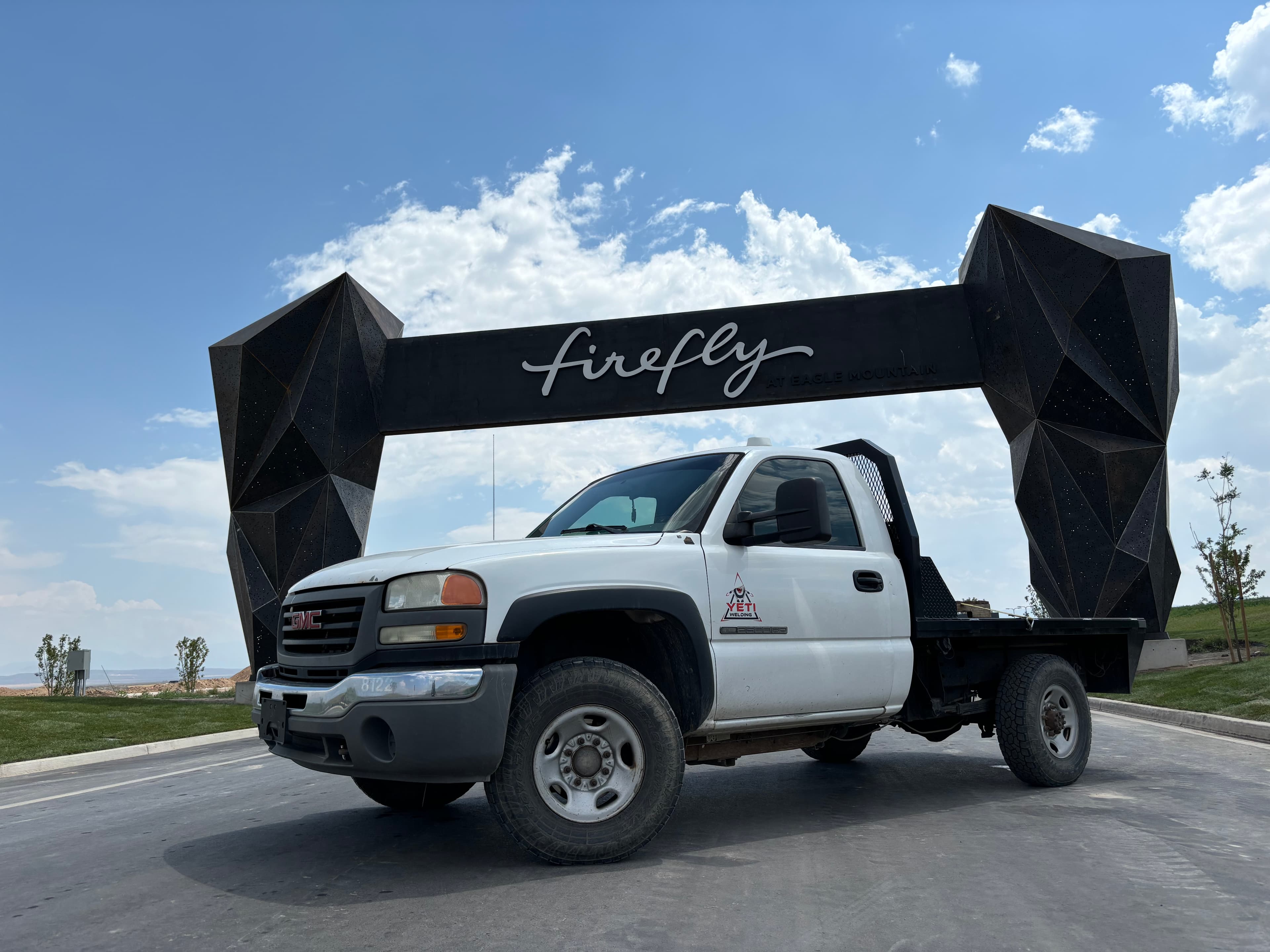 Yeti Welding professional metal fabrication workshop in Springville, Utah, showcasing skilled welders creating custom steel structures and ornamental metalwork